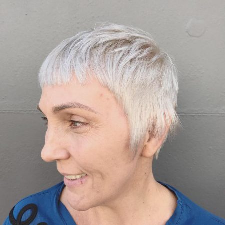 Woman with short grey pixie cut by Stu Weller